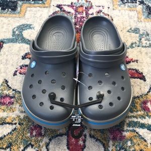 Crocs - gray with blue stripe @ toe.  NWT